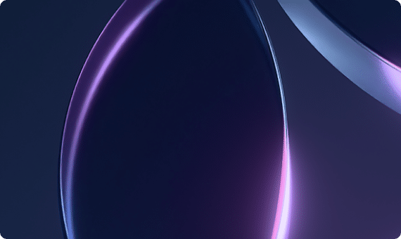 Abstract close-up of curved, glossy surfaces with purple and blue lighting on a dark background.