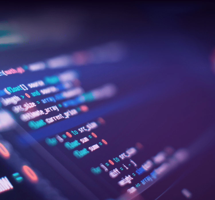 A computer screen displays colorful lines of code on a dark background, some syntax in sharp focus while others are blurred—capturing the complexity of cybersecurity and incident response in today’s digital world.